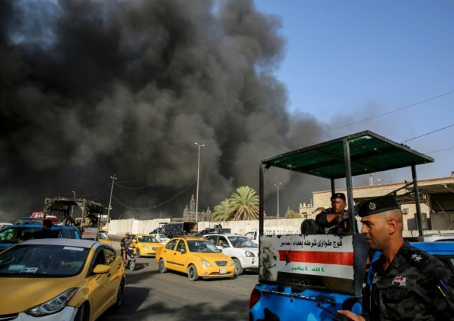 Police among four arrested after Iraq ballot fire
