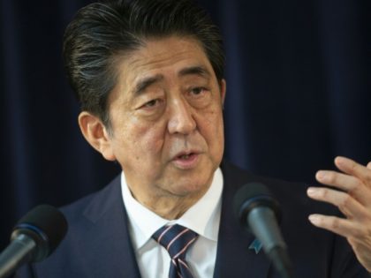 Japan working to arrange Abe-Kim talks: reports