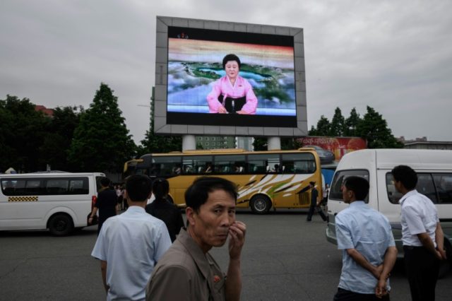 N.Korea TV summit broadcast hails Kim as 'world leader'