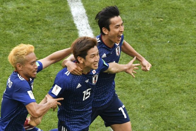 Japan beat 10-man Colombia to make World Cup history