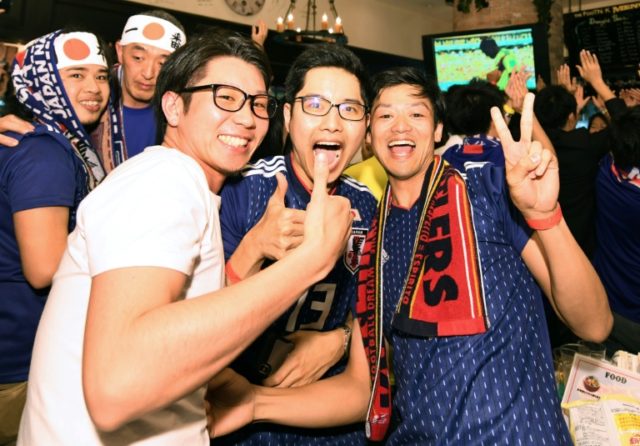Boozy Japan fans go wild after shock World Cup win