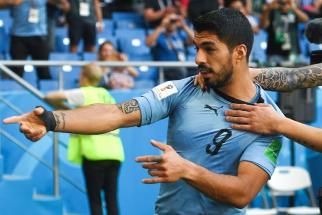 Suarez sends Uruguay into last 16 with hosts Russia