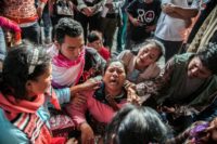 Relatives break down as they anxiously wait for news of their loved ones following the Lake Toba ferry disaster