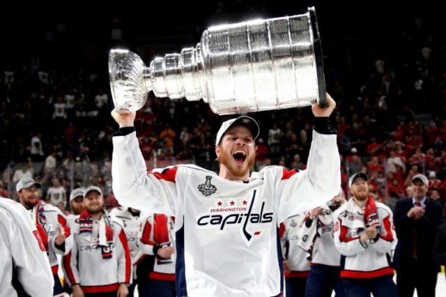 Champion Capitals lock up Carlson with eight-year deal