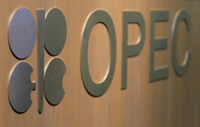 Defusing row, OPEC agrees to output rise