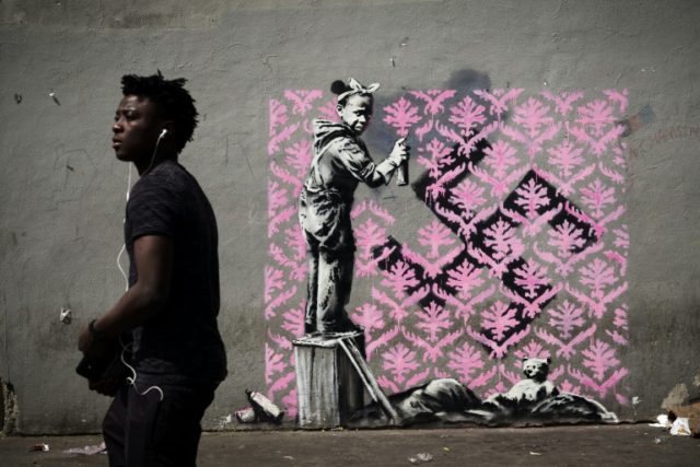 Banksy needles France on migrants with Paris mural blitz