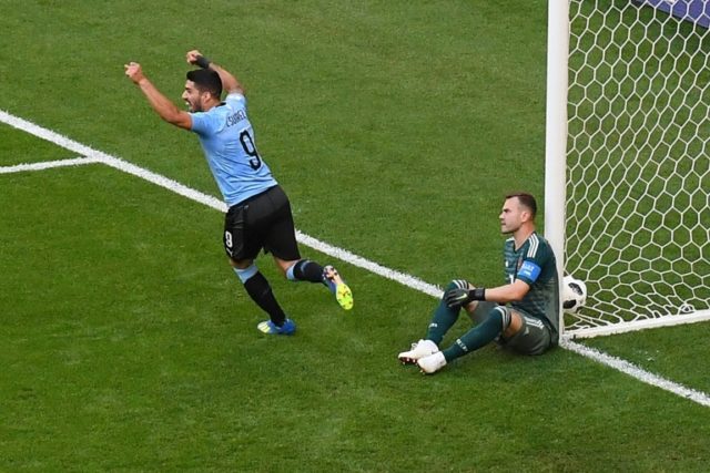 Uruguay win group as Suarez inspires 3-0 win over 10-man Russia