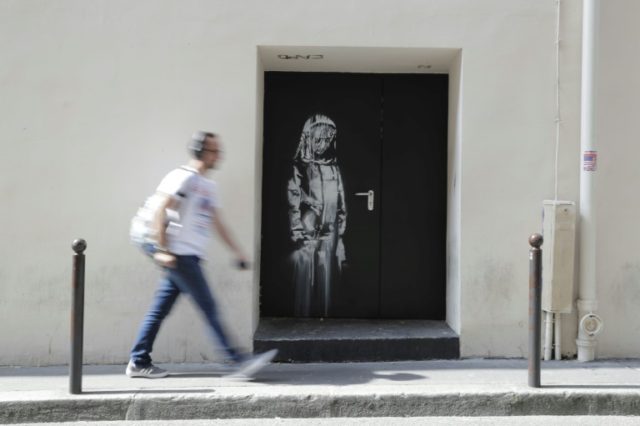 New 'Banksy' mural appears next to Bataclan in Paris