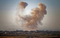 Smoke rises above opposition-held areas of Daraa province during strikes by Syrian regime