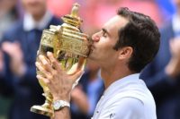 Roger Federer kisses the winner's trophy after beating Marin Cilic last year