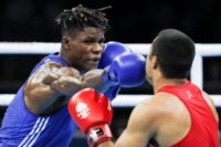 Cameroon's boxer Wilfried Seyi (L), a silver medalist in the Commonwealth Games in the 75kg category, is the only one of his team who went missing while in Australia to have returned since