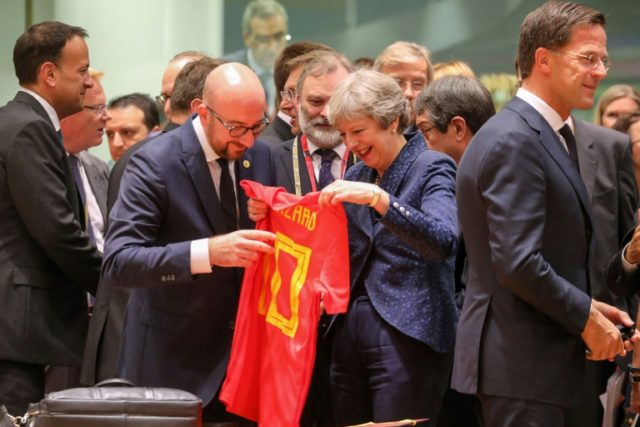Belgian PM surprises UK's May with World Cup shirt