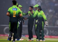 Pakistani spinner Mohammad Hafeez (C) celebrates with teammates after the dismissal of a Sri Lankan cricketer during a T20 match in Lahore, in October 2017