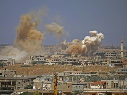Battered south Syria towns in talks on regime takeover