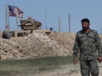 Syria In this April 4, 2018 file photo, a U.S backed Syrian Manbij Military Council soldier passes a U.S. position near the tense front line with Turkish backed fighters, in Manbij, north Syria. The People's Protection Units, known by their Kurdish acronym YPG, said in a statement Tuesday, June 5, 2018, that it's pulling out of the key northern Syrian town of Manbij, potentially easing a serious rift between the United States and Turkey. (AP Photo/Hussein Malla, File) In this April 4, 2018 file photo, a U.S-backed Syrian Manbij Military Council soldier passes a U.S. position near the tense front line with Turkish-backed fighters, in Manbij, north Syria. The People's Protection Units, known by their Kurdish acronym YPG, said in a statement Tuesday, June 5, 2018, that it's …