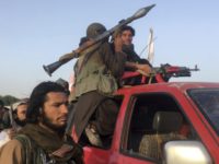 Afghanistan Explosion Taliban fighters ride in their vehicle in Surkhroad district of Nangarhar province, east of Kabul, Afghanistan, Saturday, June 16, 2018. A suicide bomber blew himself up in eastern Afghanistan on Saturday as mostly Taliban fighters gathered to celebrate a three day cease fire marking the Islamic holiday of Eid al Fitr, killing 21 people and wounding another 41, said the Nangarhar provincial Police Chief Ghulam Sanayee Stanikzai. Most of the dead and wounded were believed to be Taliban, he said. (AP Photo/Rahmat Gal) Taliban fighters ride in their vehicle in Surkhroad district of Nangarhar province, east of Kabul, Afghanistan, Saturday, June 16, 2018. A suicide bomber blew himself up in eastern Afghanistan on Saturday as mostly Taliban fighters gathered to celebrate a three-day cease fire marking the Islamic holiday of Eid al-Fitr, killing …