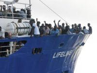 Italy Europe Migrants In this photo taken on Thursday, June 21, 2018, migrants wave from aboard ship operated by the German NGO Mission Lifeline. Italy's interior minister says Malta should allow a Dutch flagged rescue ship carrying 224 migrants to make port there because the ship is now in Maltese waters. Salvini said the rescue was in Libyan waters, which Lifeline denies. (Hermine Poschmann/Mission Lifeline via AP) Migrant