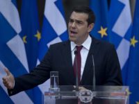 Greece Bailout Fashion Greek Prime Minister Alexis Tsipras speaks to lawmakers from his left led governing coalition in Athens, wearing a tie for the first time in more than three years, on Friday, June 22, 2018. The left wing politician had said at the beginning of his first term in office that he would only wear a tie when Greece had settled its debt problems, and in his speech, Tsipras hailed Friday’s deal in Luxembourg as a landmark decision. (AP Photo/Petros Giannakouris) For once in a tie, Greek PM Tsipras hails new debt deal