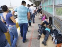 Texas Immigration In this Thursday, June 23, 2018 photo, migrant families rest from their travels to Matamoros, Mexico, along Gateway International Bridge which connects to Brownsville, Texas, as they seek asylum in the United States. (Miguel Roberts/The Brownsville Herald via AP) Trump Administration says it knows location of all children