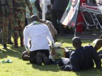 Zimbabwe Explosion Injured people are attended to as they lay on the ground following an explosion at a Zanu pf rally in Bulawayo, Saturday, June, 23, 2018. An explosion rocked a stadium where Zimbabwe's president was addressing a campaign rally on Saturday, with state media calling it an assassination attempt but saying he was not hurt and was evacuated from the scene. Witnesses said several people were injured, including a vice president. (AP Photo) Injured people are attended to as they lay on the ground following an explosion at a Zanu pf rally in Bulawayo, Saturday, June, 23, 2018. An explosion rocked a stadium where Zimbabwe's president was addressing a campaign rally on Saturday, with state media calling it an assassination attempt but saying …