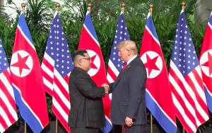 Trump gives Kim a 'thumbs up' after initial handshake