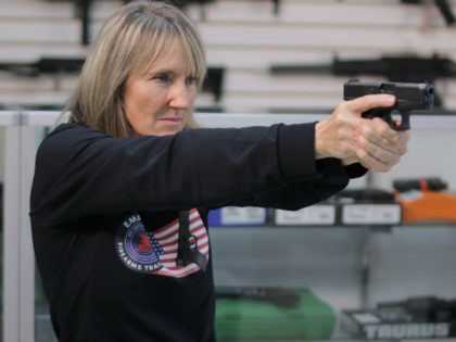 *** EXCLUSIVE - VIDEO AVAILABLE *** ORLANDO, FLORIDA - DECEMBER 11: NRA certified instructor and founder of the Florida faction of Pink Pistols Jo Martin pointing a gun, on December 11, 2016 in Orlando, Florida. A gun group are encouraging members of the gay community to take up arms after …