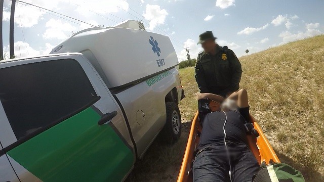 Border Patrol agents rescue an illegal immigrant who fell victim to the Texas heat near the Rio Grande River. (Photo: U.S. Border Patrol/Rio Grande Valley Sector)