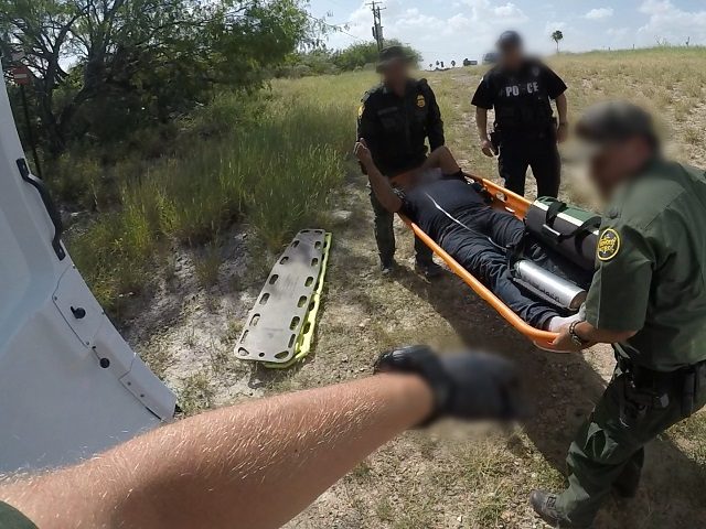 Border Patrol agents rescue an illegal immigrant who fell victim to the Texas heat near th