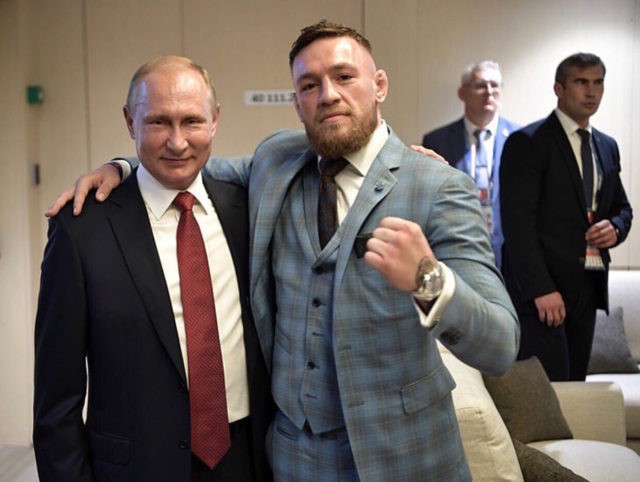 Conor McGregor poses with Russian President Vladimir Putin at the 2018 World Cup Finals in
