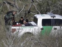 Border Wall Reality Check In this Tuesday, Nov. 15, 2016, photo, a U.S. Customs and Border Patrol agents stop a group of suspected illegal immigrants passing through a ranch near Edinburg, Texas. (AP Photo/Eric Gay)
