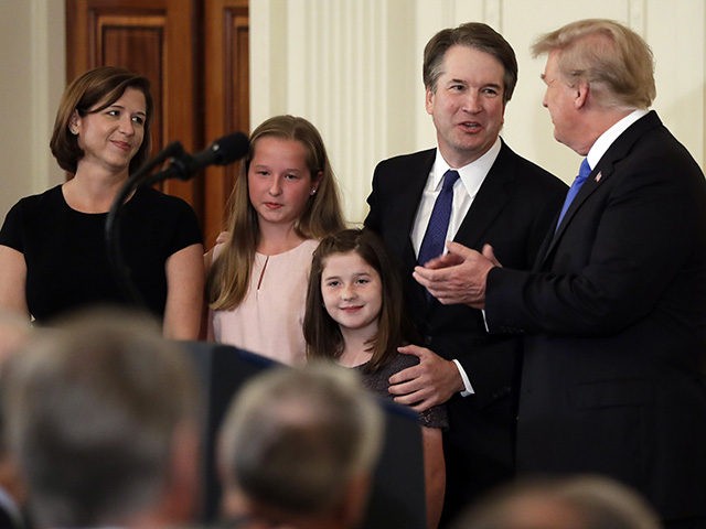 President Donald Trump greets Judge Brett Kavanaugh his Supreme Court nominee, in the East