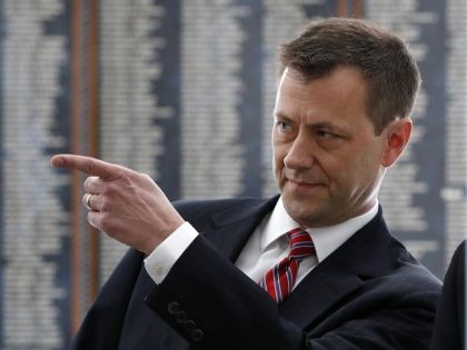 FBI Deputy Assistant Director Peter Strzok points down the hallway as he arrives for a Hou