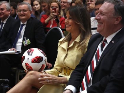 U.S. First Lady Melania Trump holds a soccer ball during a press conference after the meet