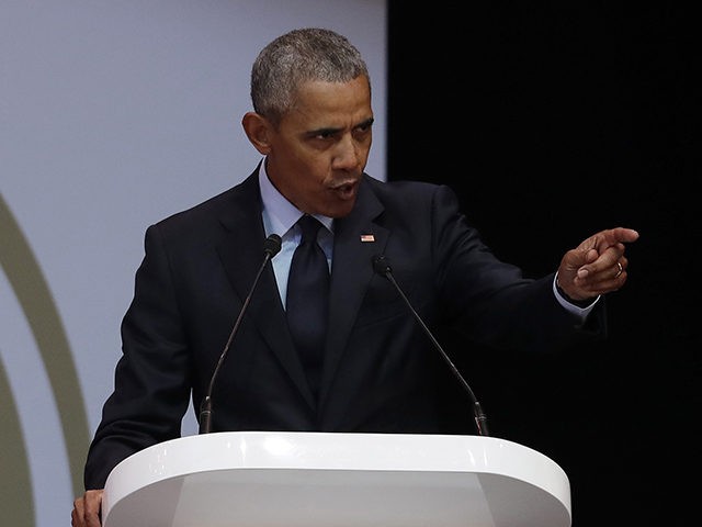 Former U.S. President Barack Obama, left, delivers his speech at the 16th Annual Nelson Mandela Lecture at the Wanderers Stadium in Johannesburg, South Africa, Tuesday, July 17, 2018. In his highest-profile speech since leaving office, Obama urged people around the world to respect human rights and other values under threat â¦