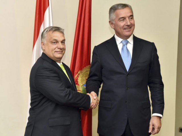 Montenegro President Milo Djukanovic, right, shakes hands with Hungary's Prime Minist