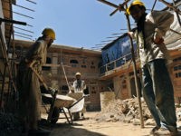 Afghan construction workers restore a traditional courtyard house in Kabul on June 30, 2010, with the support of the Afghan government and the Turquoise Mountain Foundation. The area, called Murad Khani, was on the frontline of fighting during the Afghan civil war of the 1980s, and became a rubbish tip …