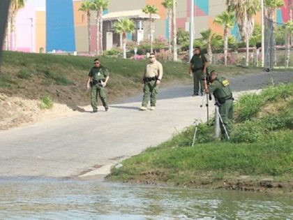 Border Patrol agents investigate the scene where an illegal alien from Mexico assaulted a
