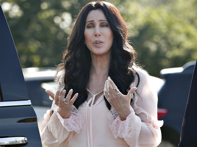 Singer and actress Cher stops to talk to media as she leaves a fundraiser for Democratic presidential candidate Hillary Clinton at the Pilgrim Monument and Provincetown Museum in Provincetown, Mass., Sunday, Aug. 21, 2016. (AP Photo/Carolyn Kaster)