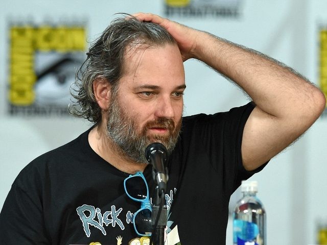 Writer/producer Dan Harmon fixes his hair as he looks at a monitor showing the 'Commu