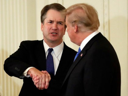 President Donald Trump shakes hands with Judge Brett Kavanaugh his Supreme Court nominee,