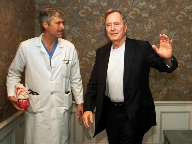 In this Feb. 25, 2000, file photo, former President George H.W. Bush waves as he leaves Methodist Hospital with his cardiologist, Mark Hausknecht, after a news conference in Houston. Hausknecht, who once treated former President George H.W. Bush, was fatally shot by a fellow bicyclist Friday, July 20, 2018, while …