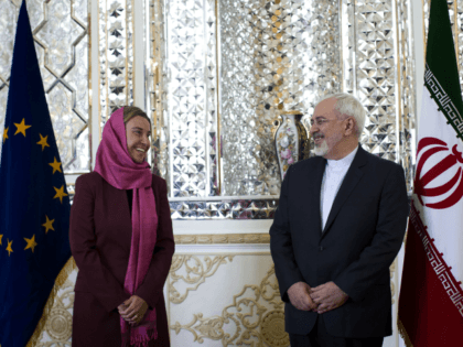 Iranian Foreign Minister Mohammad Javad Zarif (R) and EU foreign policy chief Federica Mogherini pose for a picture ahead of a joint news conference in the capital Tehran on July 28, 2015. Mogherini is in Tehran for talks on implementing this month's historic nuclear deal between Iran and the major …