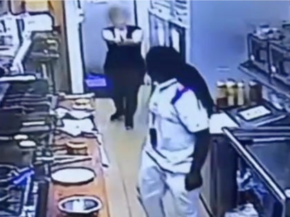 Milwaukee police are seeking a male suspect who launched a vicious attack on a restaurant employee last week; the attack was thwarted when another employee pulled a gun.