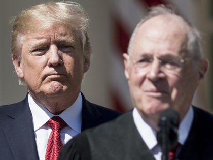 US President Donald Trump (L) listens while Supreme Court Justice Anthony Kennedy speaks d