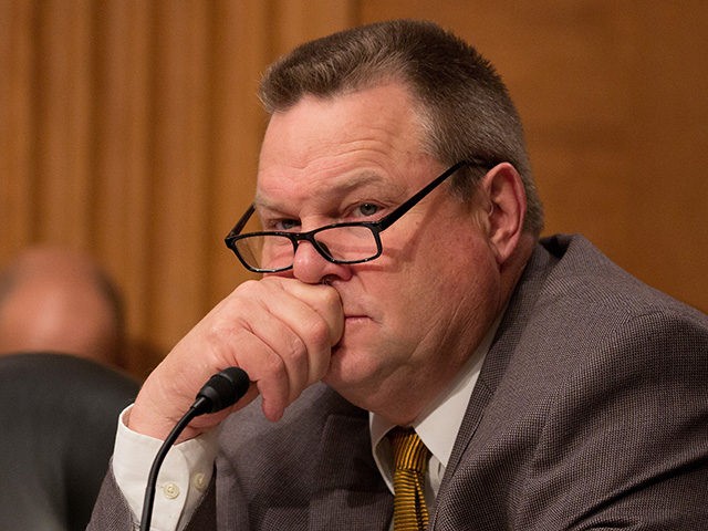 WASHINGTON, DC - MAY 18: U.S. Sen. Jon Tester (D-MT) listens to Treasury Secretary Steven Mnuchin at a Senate Banking Committee and International Policy hearing on Capital Hill May 18, 2017 in Washington, DC. Mnuchin spoke before the committee that oversees bank regulations in his first congressional testimony since being …