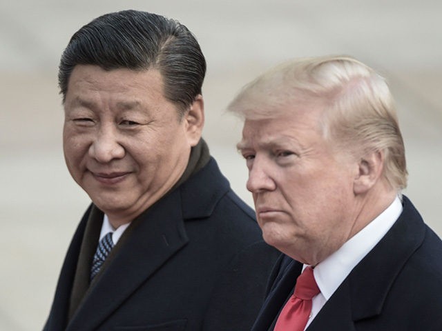 China's President Xi Jinping (L) and US President Donald Trump attend a welcome ceremony a