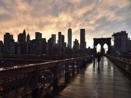 The Manhattan skyline is seen from the Brooklyn Bridge following a downpour in New York Ci