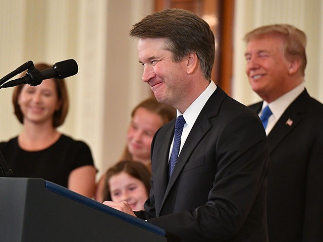 Supreme Court nominee Brett Kavanaugh speaks while his wife Ashley Estes Kavanaugh (L) and US President Donald Trump listens after the announcement of his nomination in the East Room of the White House on July 9, 2018 in Washington, DC. (Photo by MANDEL NGAN / AFP) (Photo credit should read …
