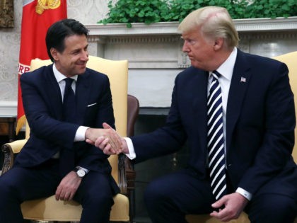 U.S. President Donald Trump (R) shakes hands with Prime Minister of the Italian Republic G