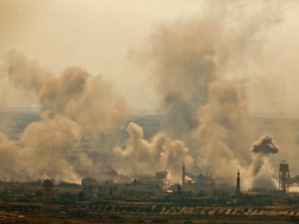 A picture taken on July 16, 2018 from the Israeli side in the annexed-Golan Heights, shows smoke plumes rising from reported Syrian and Russian air strikes across the border in Syria's southeastern Quneitra province. (Photo by JALAA MAREY / AFP) (Photo credit should read JALAA MAREY/AFP/Getty Images)